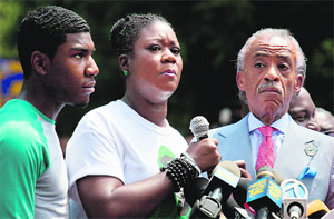 Sybrina Fulton (centre), mother of slain teenager Trayvon Martin, during a rally in New York on Saturday.