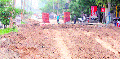 Slow pace of work being executed on the Guru Ram Dass International Airport road in Amritsar causes inconvenience to residents and commuters.