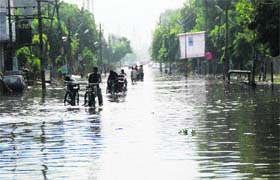 Power House road flooded with rainwater, after it poured heavily on Sunday night