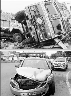 Trucks overturn after a collision at Landran village; and a damaged car after it met with an accident in Mohali on Monday.