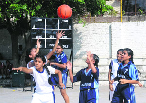 Players in action during a basketball match at New Public School, Sector 18, Chandigarh, on Monday.