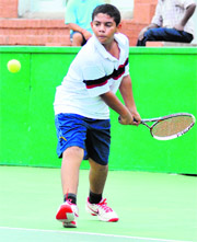Anmol Ratan plays a shot during a tennis match at the CLTA, Sector 10, in Chandigarh on Monday
