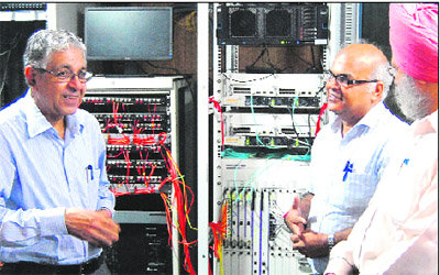 Prof Arun Kumar Grover, Vice-Chancellor, Panjab University, interacts with Prof Tankeshwar Kumar after inaugurating the Wi-Fi system on the campus on Monday. 