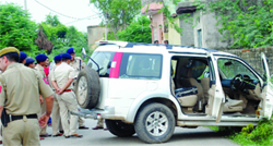 The Delhi Police personnel at the encounter site at Sannoth in Outer Delhi on Monday. Tribune photo