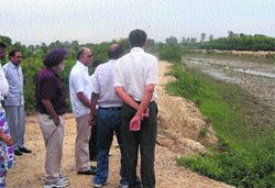 Deputy Commissioner NK Solanki, accompanied by officials of various departments, reviews flood-control measures in Kaithal and Kalayat towns on Monday. Tribune photo