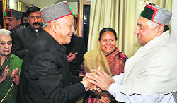 Chief Minister Virbhadra Singh welcomes Janardan Dwivedi, Rajya Sabha MP, at Oak Over in Shimla on Sunday evening. 