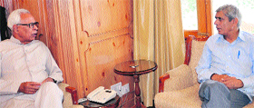 Governor NN Vohra with MLA Nizam-ud-din Bhat in Srinagar on Monday.