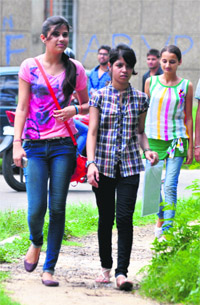 Students on their way to college in Jammu on Monday. 