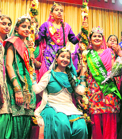 Rain fest: Students of St Soldier Divine Public School, Mithu Basti, enjoy swings during Teej celebrations in Jalandhar.