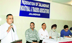 BJP leader KD Bhandari addresses a meeting of the Federation of Jalandhar Industrial and Traders Association on Monday.