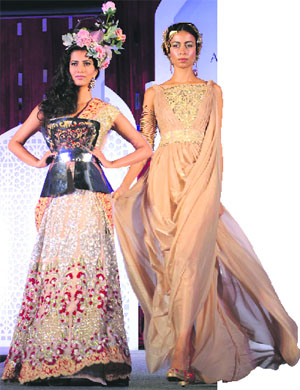 A creation by Falguni and Shane Peacock; and (R) an outfit by Suneet Varma.