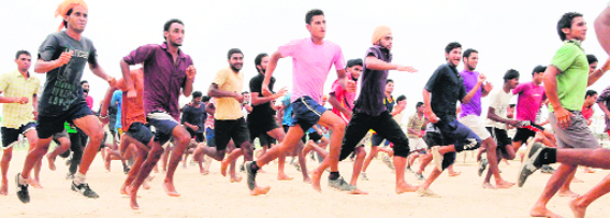 Candidates participate in a race during the Army recruitment rally at Khasa near Amritsar on Tuesday. A Tribune Photograph 