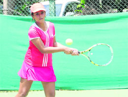 A player in action during a tennis match at the CLTA, Sector 10, in Chandigarh on Tuesday.