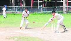 A batsman plays a shot during a match at Govt Model Senior Secondary School, Sector 19, in Chandigarh on Tuesday. 