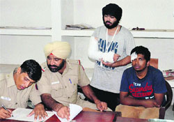 Injured Ronak Singh and Shekhar Rastogi record their statements at the Sector 17 police station.