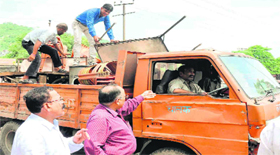Material seized after removing encroachments being taken away in an MC truck in Haridwar on Tuesday.