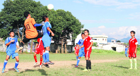 Players in action during a match in the Hemwati Nandan Bahuguna Memorial Football Tournament in Dehradun on Tuesday.