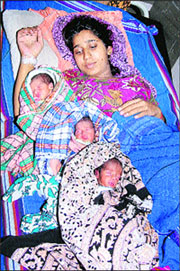 Soni Devi from Rampura village with her triplets in a private hospital at Hisar. The mother and the newborns were discharged from hospital on Tuesday.