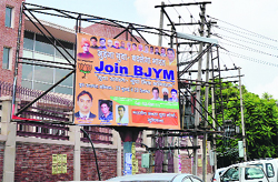 Illegal political hoardings installed on the Rani Jhansi Road in the Civil Lines, Ludhiana, on Tuesday. Photo: Inderjeet Verma
