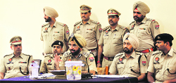 Commissioner of Police Paramjit Singh Gill (centre) addresses a press conference in Ludhiana on Tuesday. Tribune photo: Himanshu Mahajan