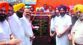Som Parkash (second from right), CPS, Local Bodies, lays the foundation stone of a tube well at Talania village on Tuesday.