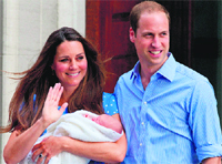 Prince William and Catherine, Duchess of Cambridge, show their newborn to world media outside the Lindo Wing of St Mary's Hospital in London on Tuesday.  AFP