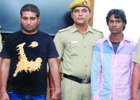 Two members of the Bunti-Bubli gang being produced before the media after their arrest by the Delhi Police, at Connaught Place police station in New Delhi on Wednesday
