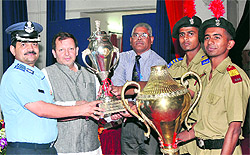 Karnal MP Arvind Sharma presents the trophy for best performers during the 53rd founders day celebrations at Sainik School, Kunjpura, on Wednesday