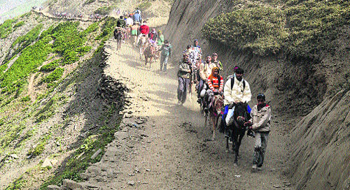 A batch of 659 pilgrims on Wednesday left the Jammu base camp for the Amarnath cave shrine in south Kashmir Himalayas. Here, pilgrims pass through Baltal on their way to the holy cave. 