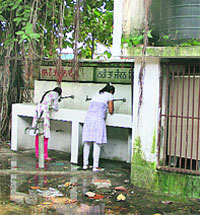 Students drink water from taps surrounded by filth at Government Senior Secondary School, Model Town, in Jalandhar. 