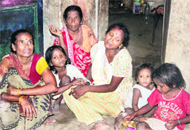 Relatives of migrant girl Prem Sheela mourn her death at her house in Jalandhar on Wednesday.