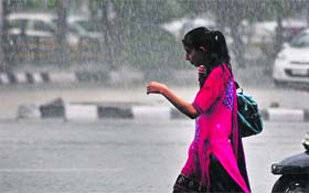 A girl caught unawares by the rain  in Ludhiana on Wednesday