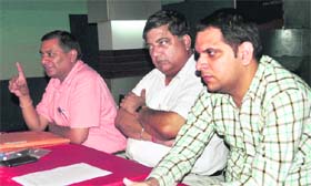 An aggrieved businesman addresses a press conference in Ludhiana on Wednesday