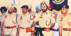 Police Commissioner PS Gill shows the fake AK-47 rifle seized from the accused at a press meet on Wednesday. Tribune photo: Himanshu Mahajan