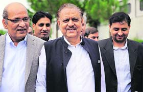 Mamnoon Hussain (C), a presidential candidate from the PML-N, in Islamabad on Wednesday