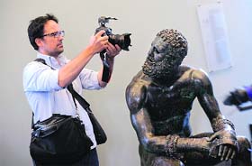 The bronze Boxer of Quirinal is photographed after returning from New York to Rome's National Roman Museum on Wednesday