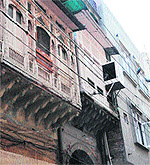 New constructions juxtaposed with centuries-old buildings in Amritsar are a common sight