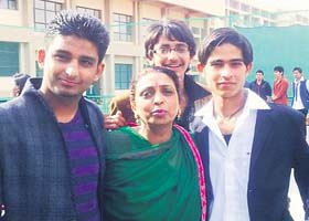 Samvit (left) with a teacher and Pradeep (right) who is missing