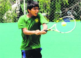 A player hits a shot during the CLTA-AITA Talent Series Tennis Tournament in Chandigarh on Thursday