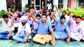 Members of PUSU stage a protest outside the Dr Harvansh Singh Judge Institute of Dental Sciences and Hospital in Chandigarh on Thursday