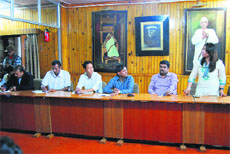 Members of an NGO discuss ways to manage solid waste during an MC meeting in Mussoorie on Thursday. 