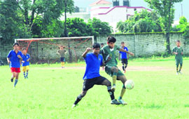 Players in action during a match in the Hemwati Nandan Bahuguna Memorial Football Tournament in Dehradun on Thursday. 