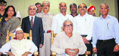 (Left to right standing) New HPSC members Savita Tayal, Manbeer Badhana (Chairman), Surinder Sharma, Dr Harinder Pal Singh and Jagannath with Governor Jagannath Pahadia and Chief Minister Bhupinder Singh Hooda after taking oath in Chandigarh on Thursday.