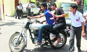 Away from the eyes of their parents, underage drivers flout traffic rules in Jammu on Thursday