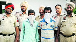 Snatchers being taken to a court by the police in Ludhiana on Thursday