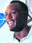 Usain Bolt poses for photographs during a press conference in central London on Thursday, ahead of the IAAF Diamond League Anniversary Games.  AFP