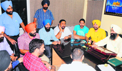 Officials hold the auction of fancy and VIP numbers at the District Transport Office in Amritsar on Friday. Photo: Vishal Kumar