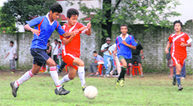Players in action during a match in the Hemwati Nandan Bahuguna Memorial Football Tournament in Dehradun on Friday.