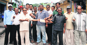 Residents of Didihat town in Pithoragarh district on Friday distribute sweets over the decision of the state government to exclude 111 villages from the Askot Musk Deer Sanctuary notified area.