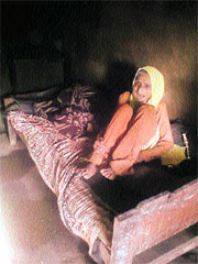 The old woman, who was rescued by the women commission, in her room in Mandi on Friday. 